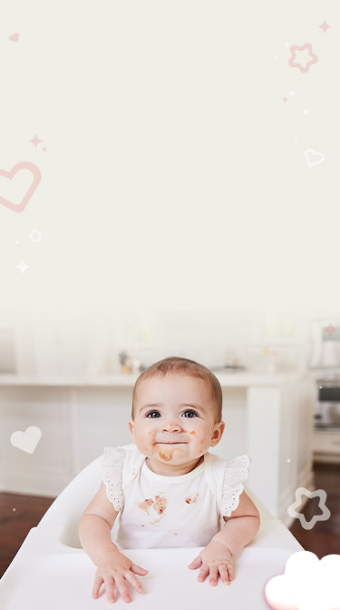 Baby with stains on t-shirt and face