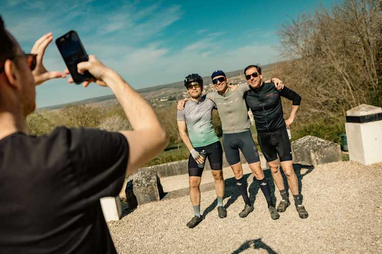 Group photo of smiling cyclists