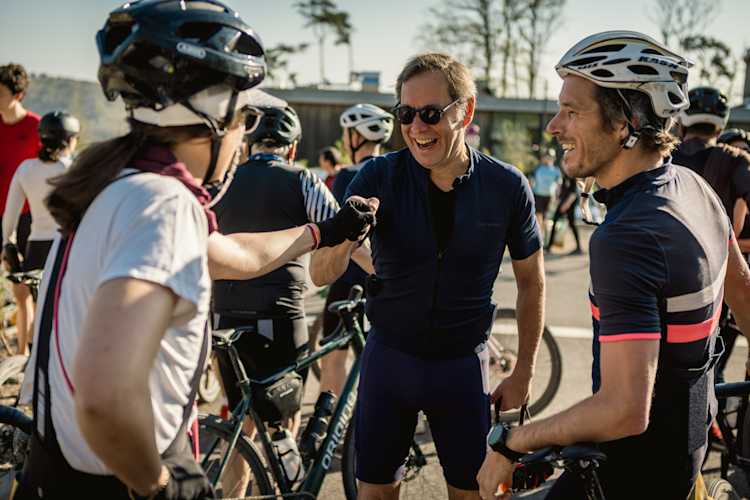 Cyclists sharing a break and chatting
