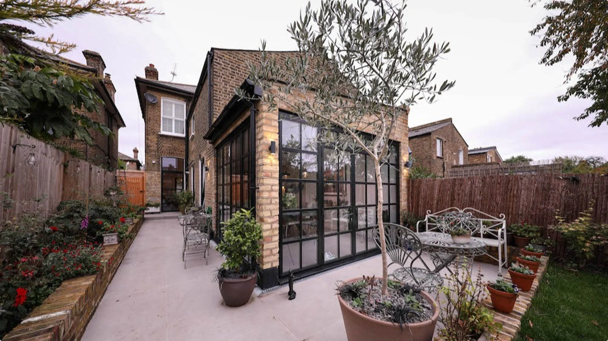 A modern rear single-storey extension, complete with stylish Crittall-style windows