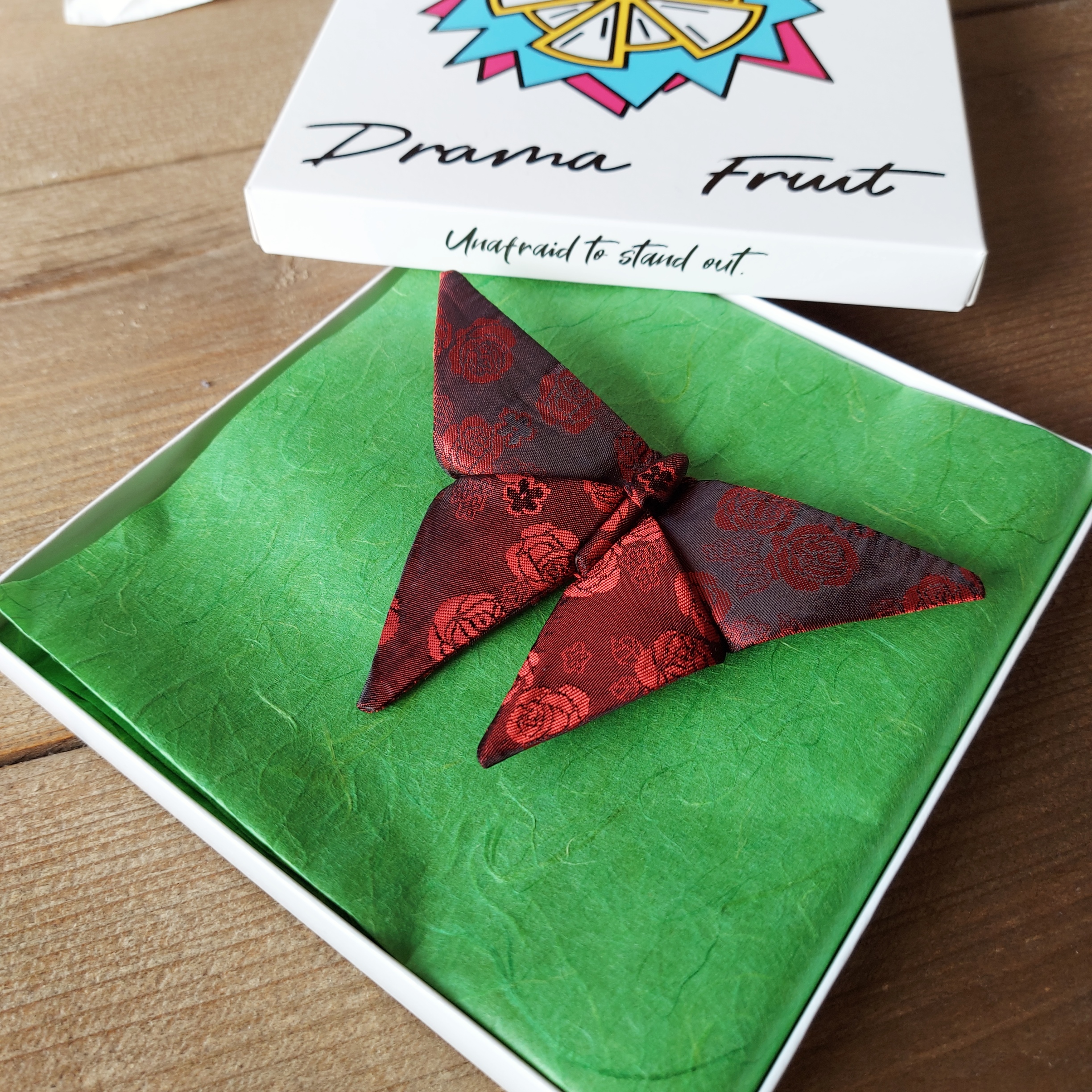 Origami butterfly bow tie with red roses design in a box