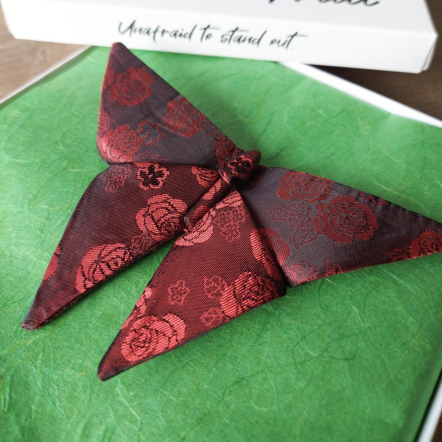 Origami butterfly bow tie with red roses design in a box