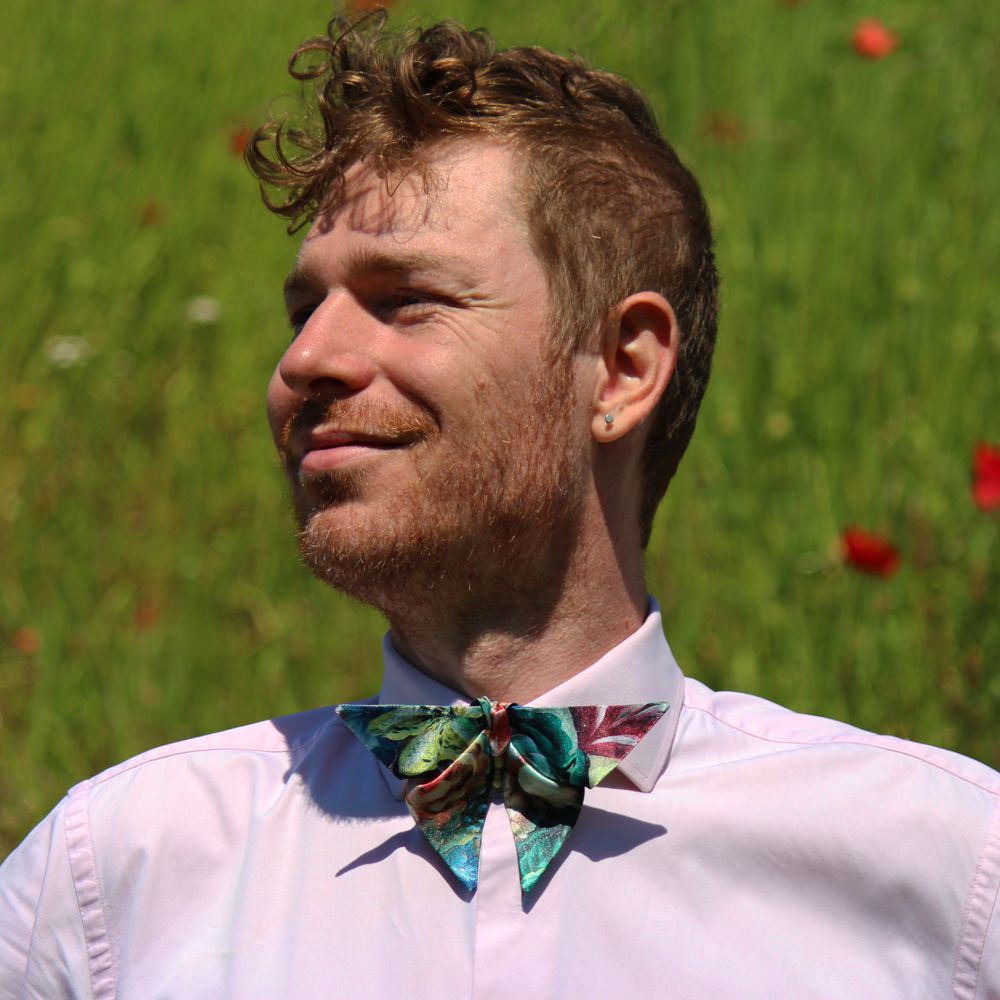 man wearing Satin origami bow tie with floral pattern