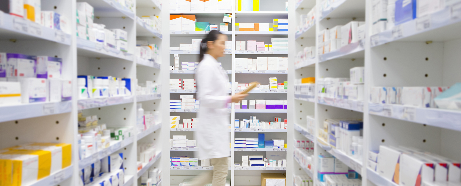 Hero-Pharmacist-Walking-In-Pharmacy-offset-617389-14-April-2020