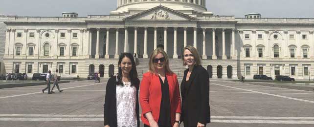 three lilly scientist standing outside capitol hill