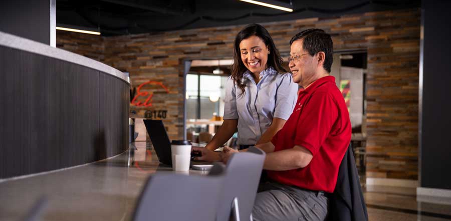 two people collaborating in cafeteria