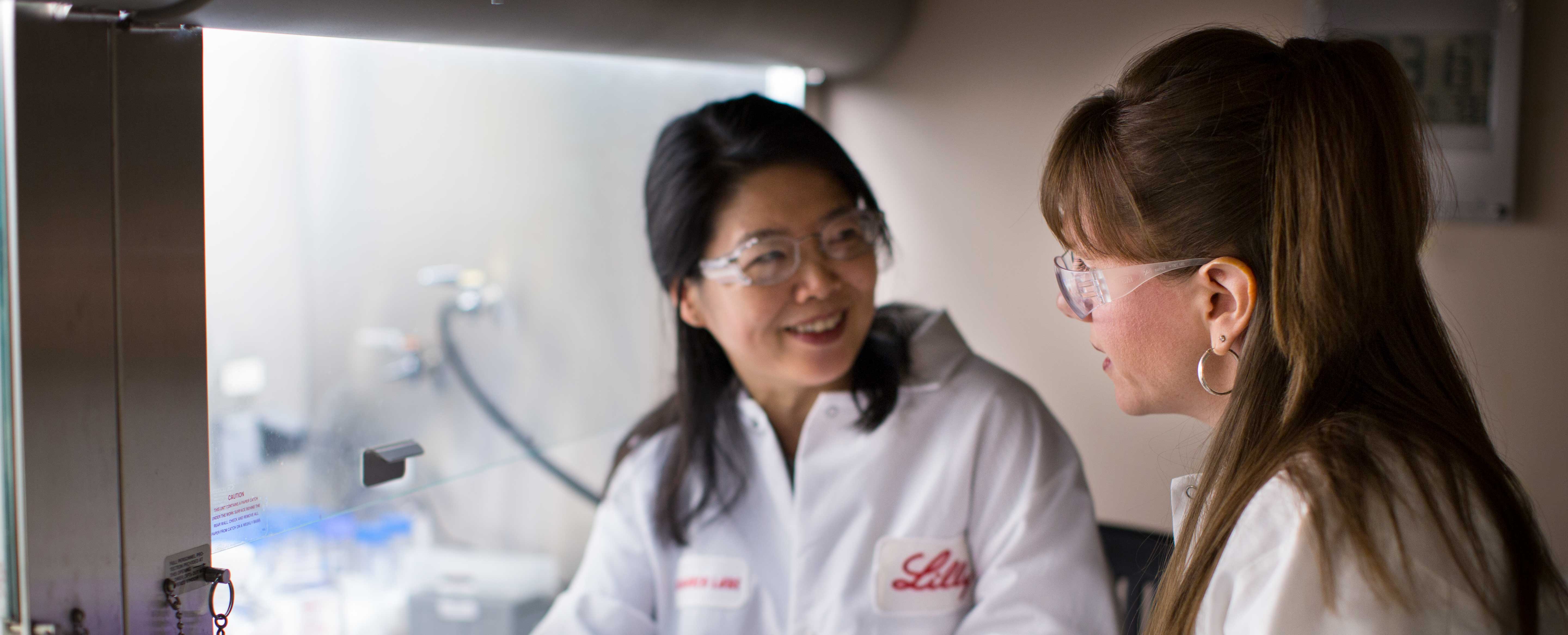 two scientists talking in the lab