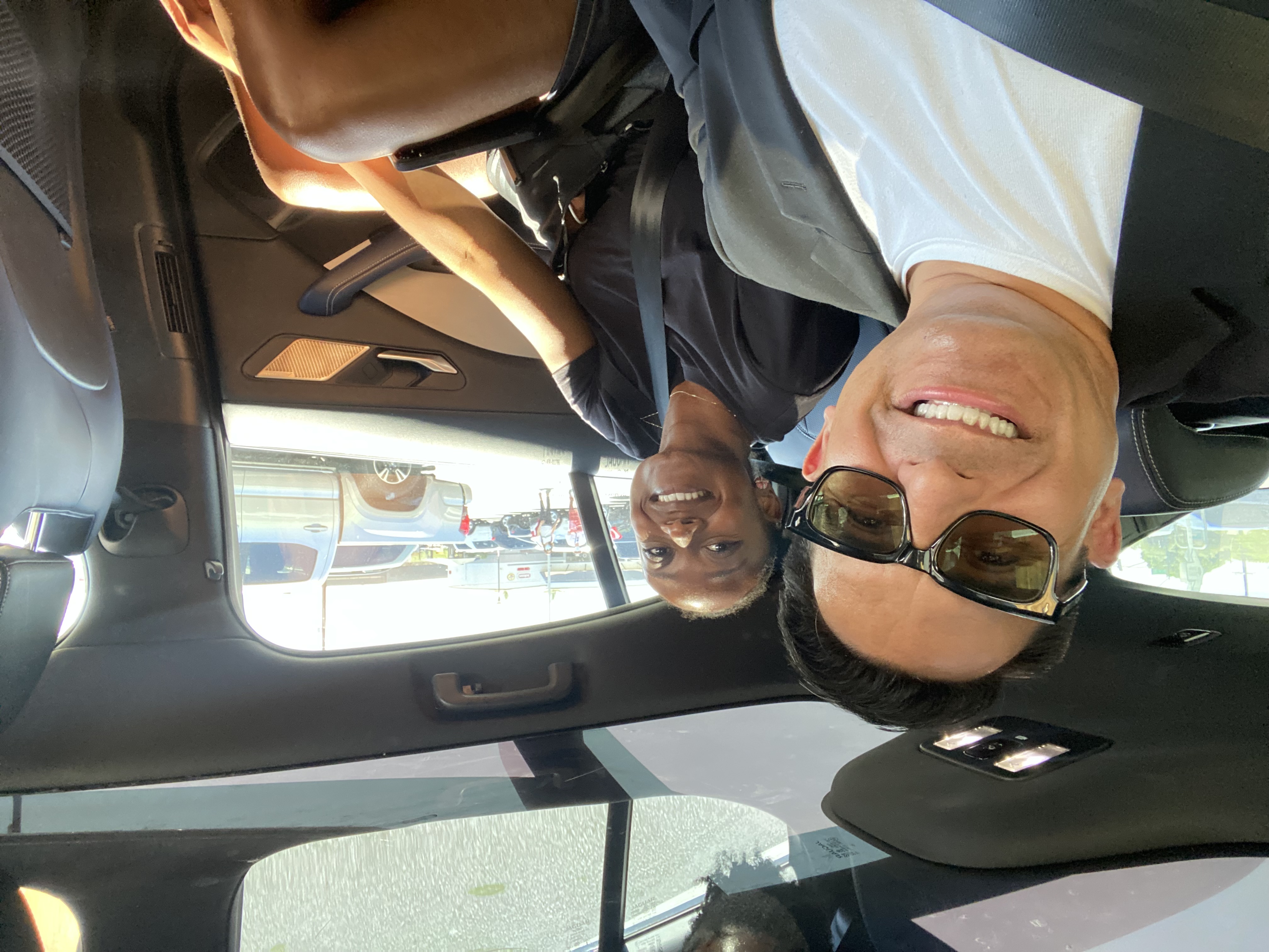 Selfie of Oscar and Rachel in the backseat of a Waymo autonomous vehicle