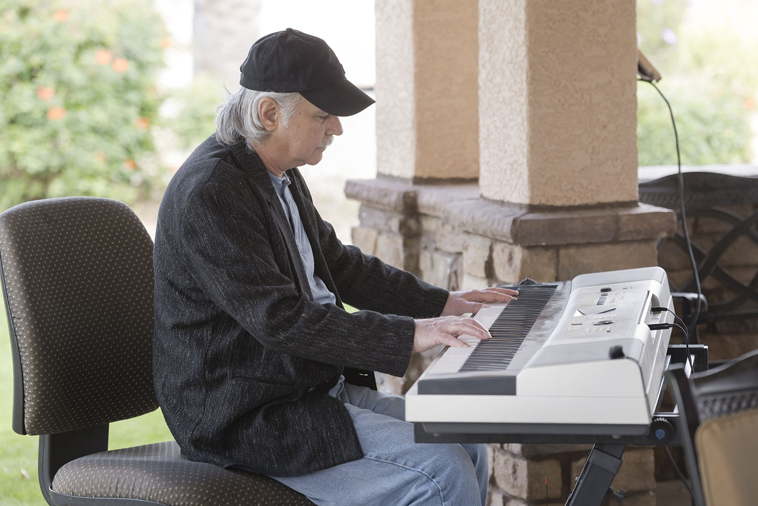 Brian playing the piano outside