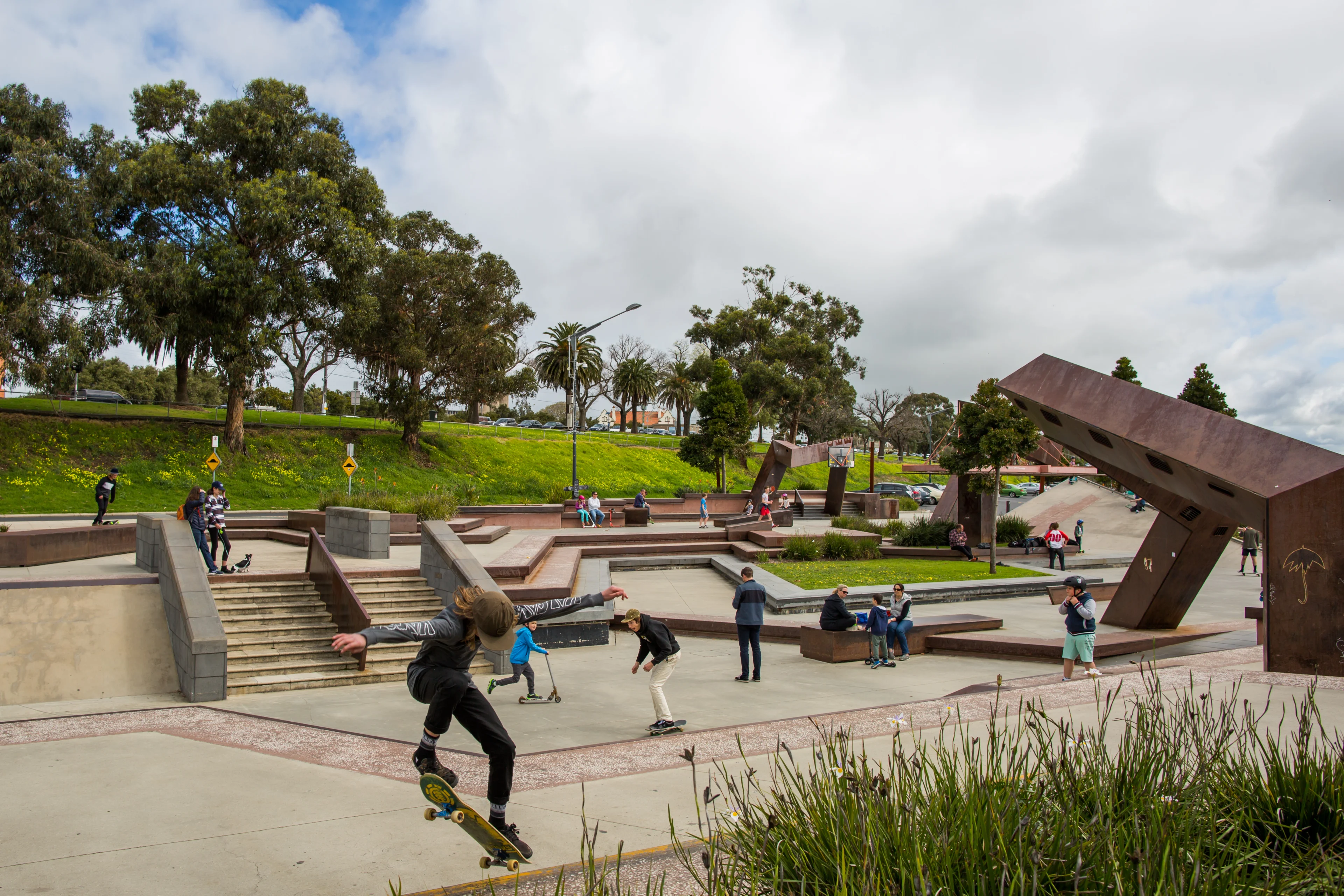 Kids and teenagers on skateboards at the Geelong Waterfront Skate Park