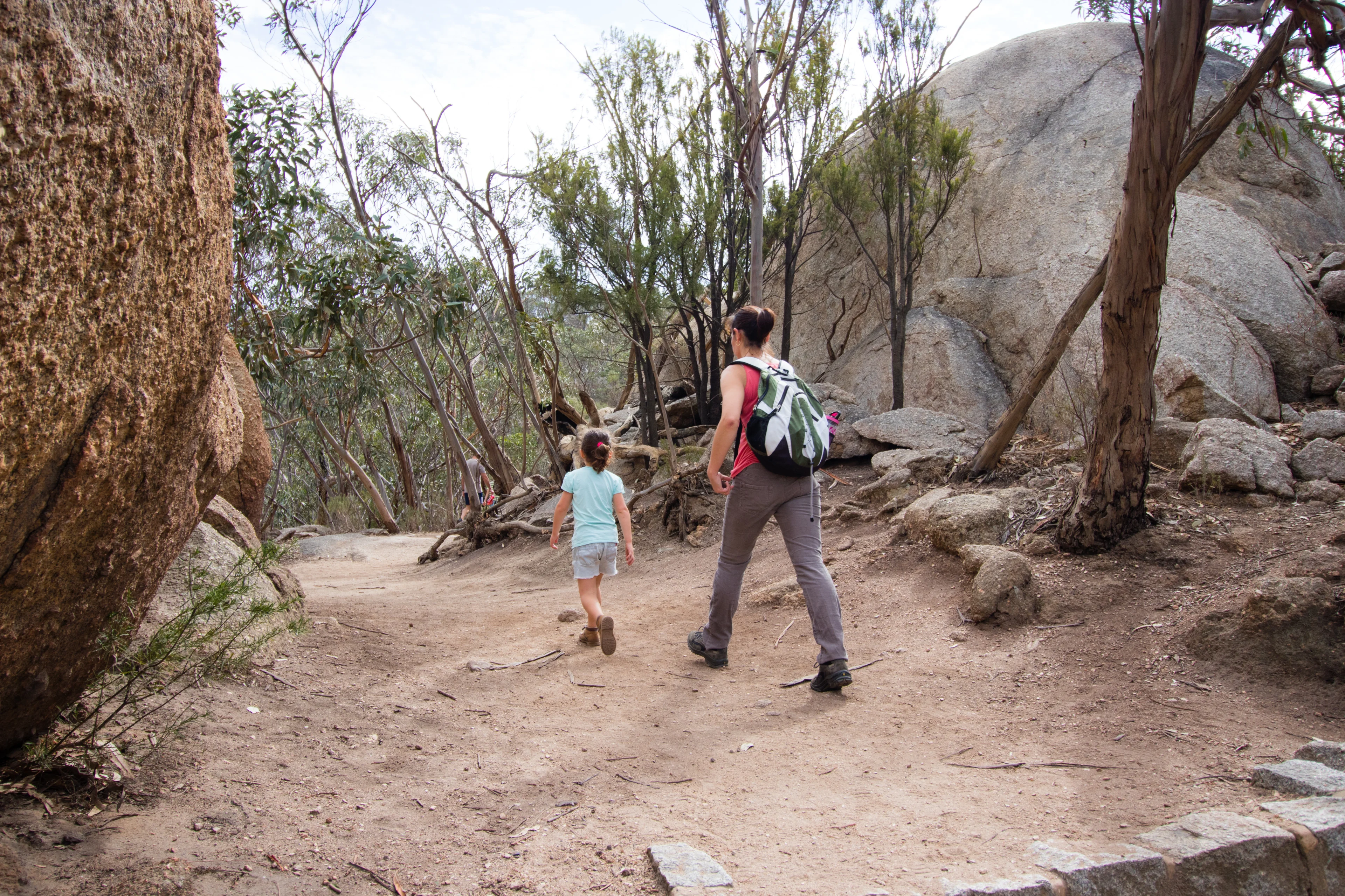 Woman and kid walking near the Big Rock at the You Yangs, Victoria