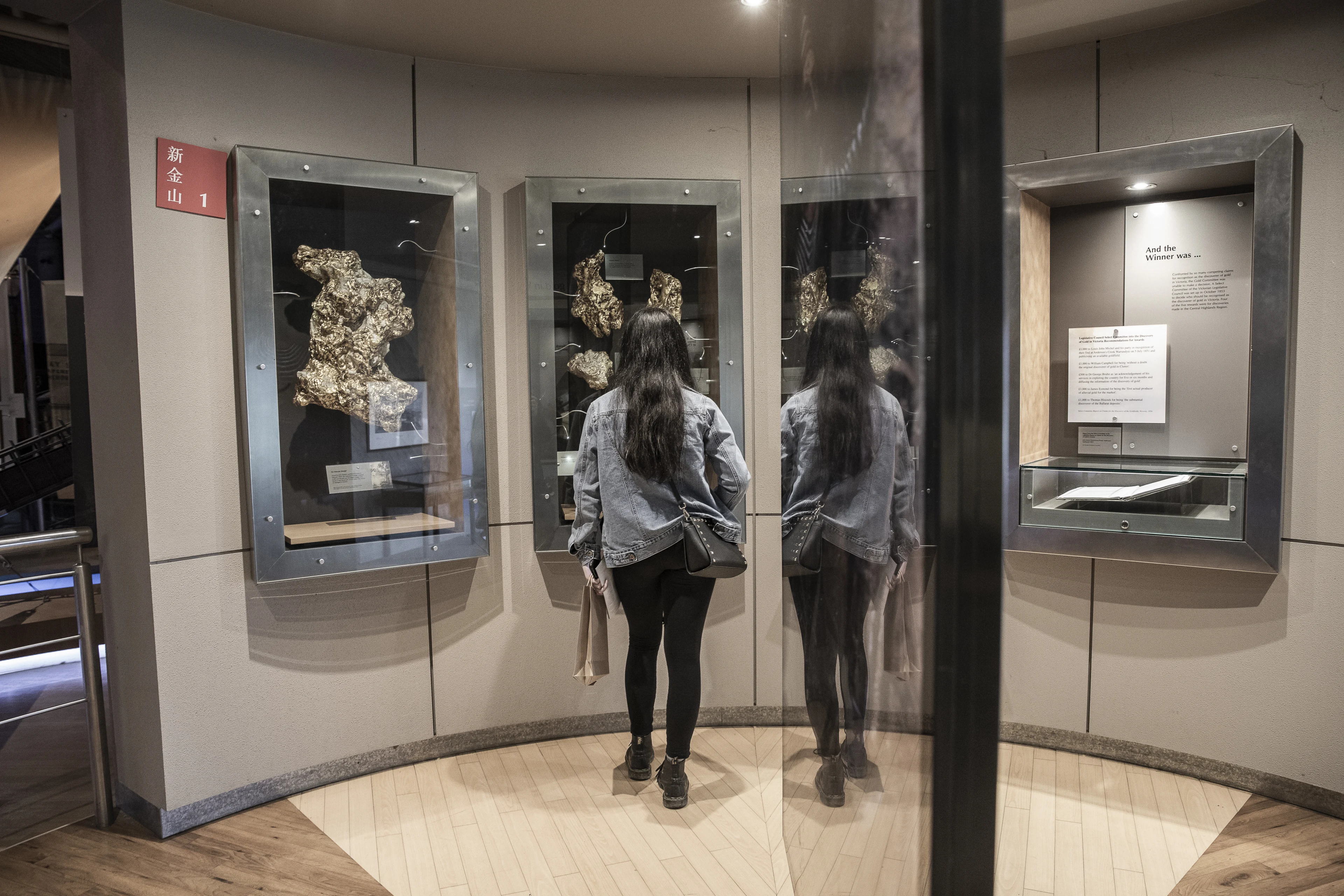 Teenager looking at gold displays at the Gold Museum at Sovereign Hill, Ballarat