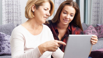 Mother and daughter looking at a laptop