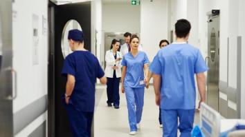 Doctors and nurses walking through corridor in a hospital