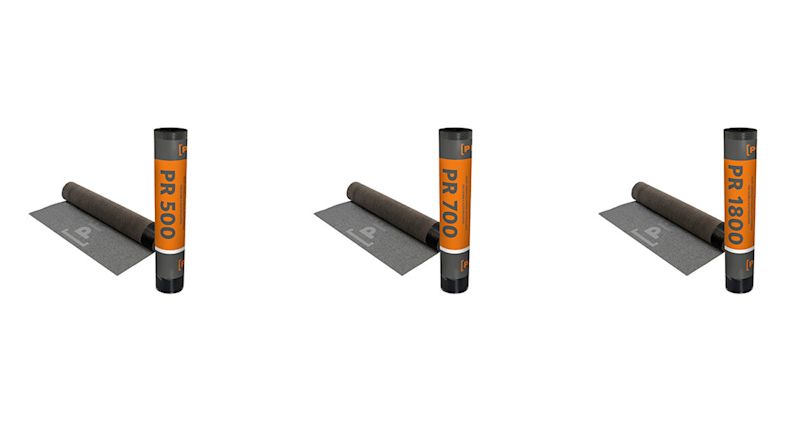 Tre takrullar med orange etiketter PR 500 PR 700 och PR 1800 intill utrullade mörkgrå mattor