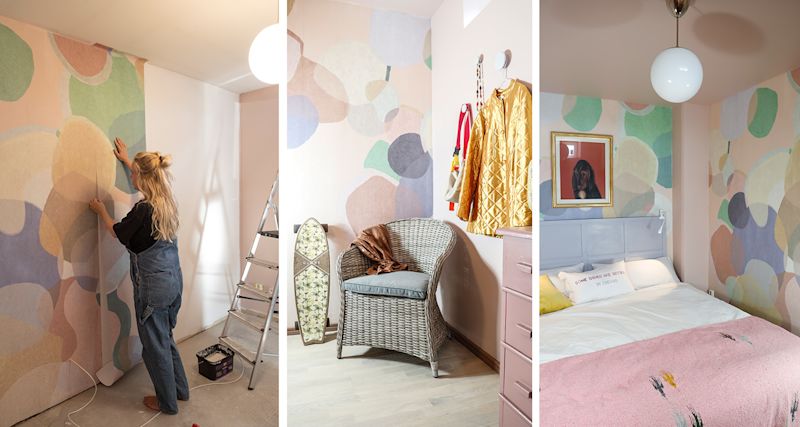 Sovrum med pastellcirkelmönstrad tapet, rottingfåtölj, gul jacka på krok och rosa pläd.