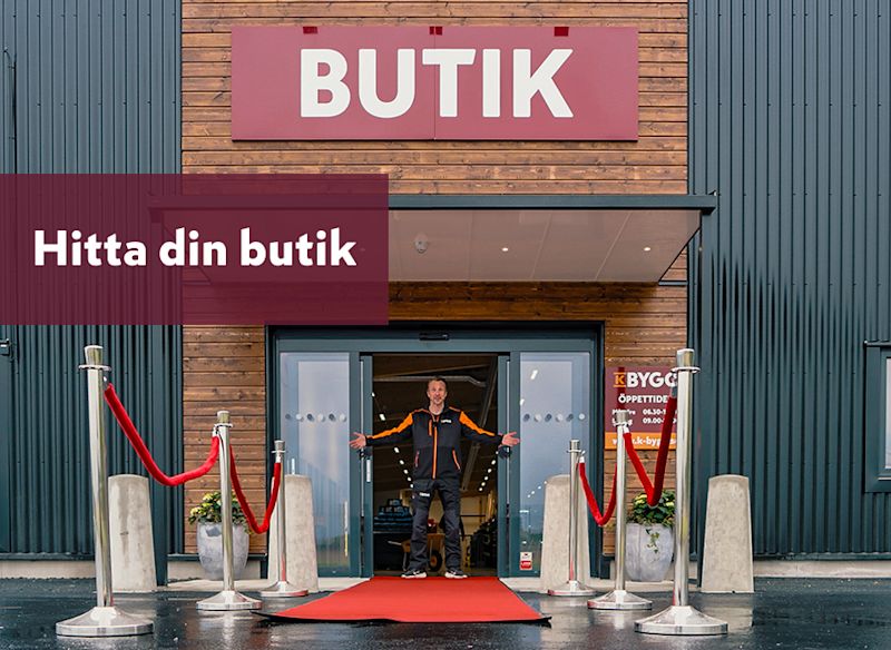 en byggnad med en stor skylt där det står "K BYGG". Under skylten finns mindre text som lyder "Hitta din butik".