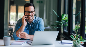 man smiling on the phone