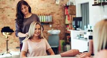 Image of a hair dresser cutting a client's hair