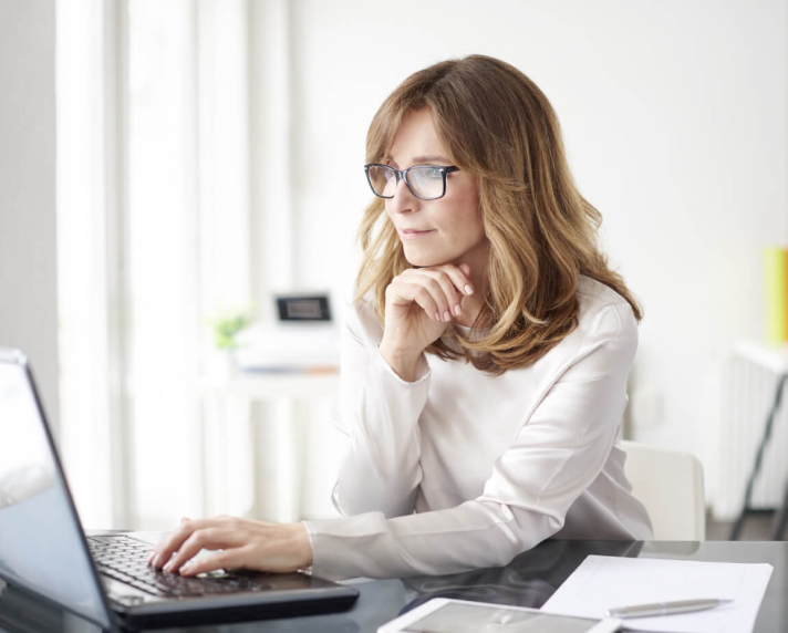 Woman sitting at her laptop.