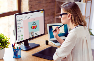 image of woman on a computer working on an email campaign