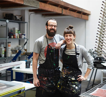 couple in aprons at studio