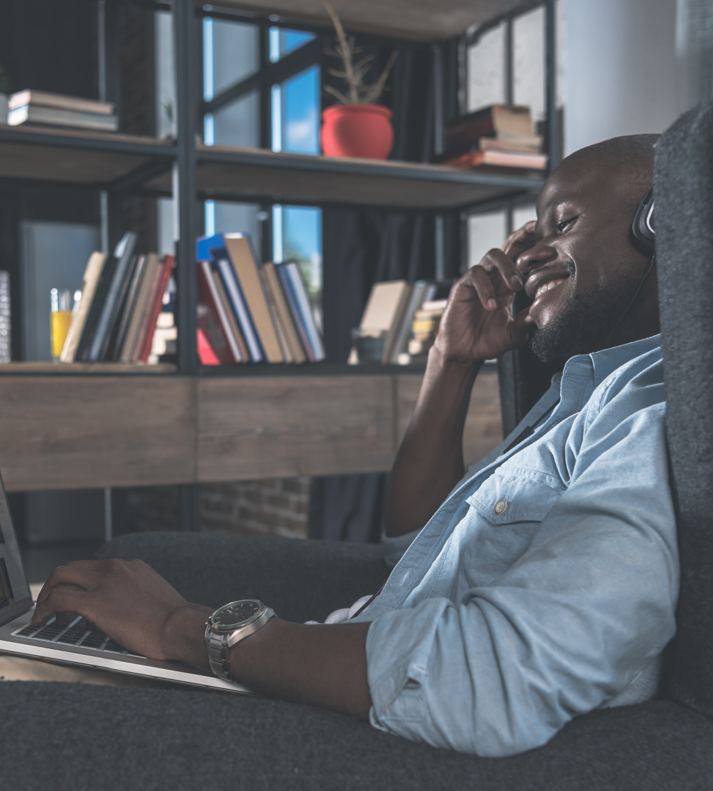 Man listening to music while working on his computer