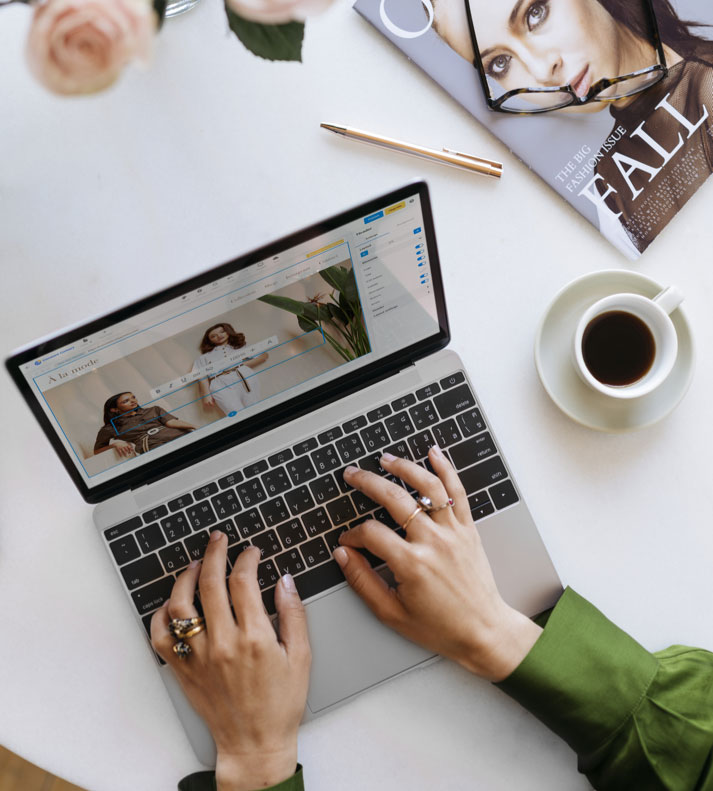 Person typing on laptop while building their website