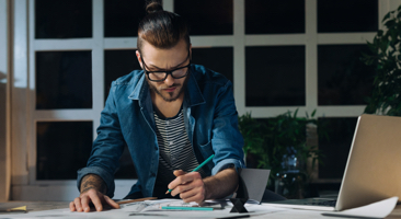 Image of a designer working at his desk