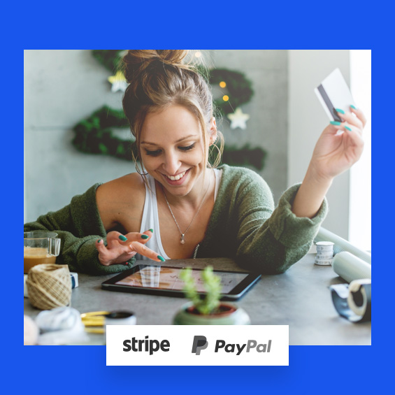 woman holding credit card while online shopping