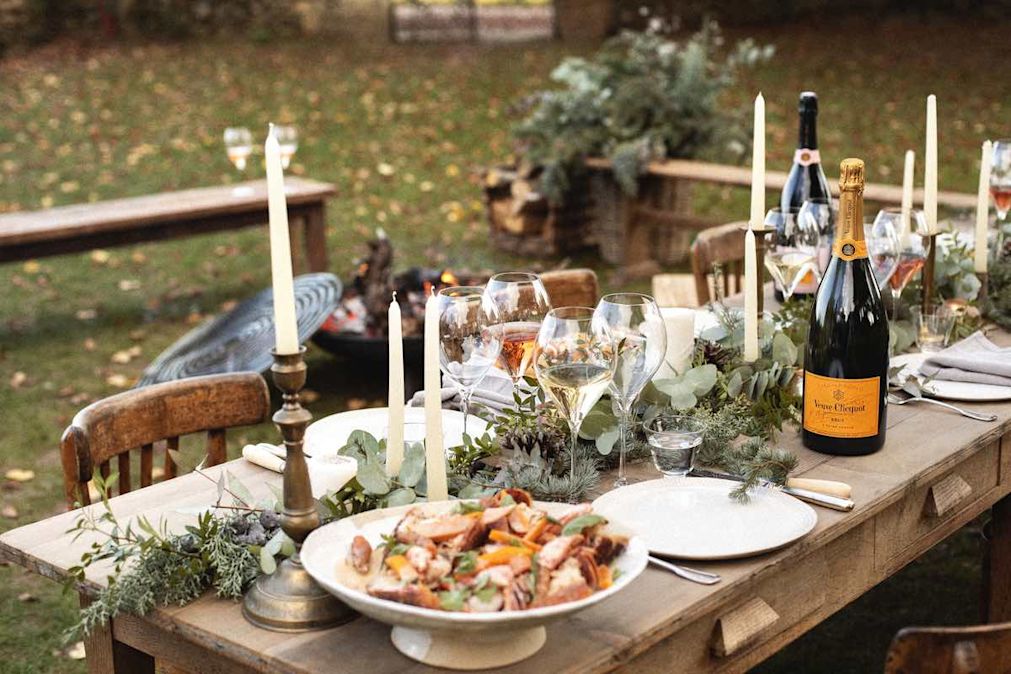 A garden party with table dressed with Champagne