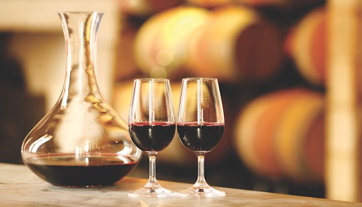Red wine in decanter and glasses