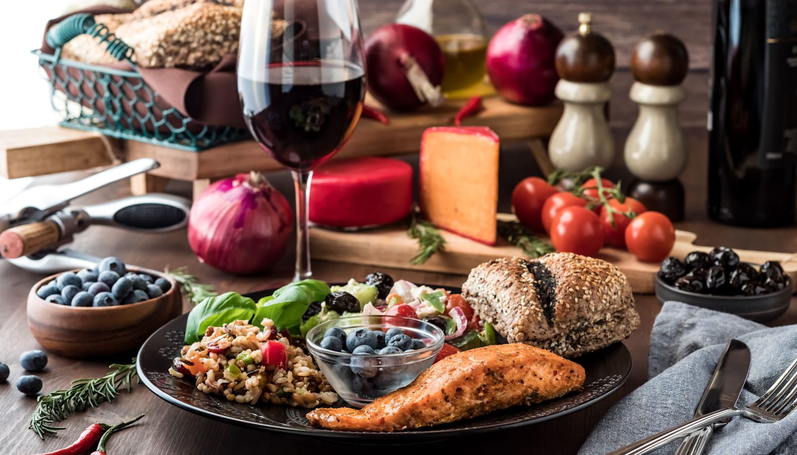 A salmon fillet dish accompanied with a glass of red wine - wine with salmon