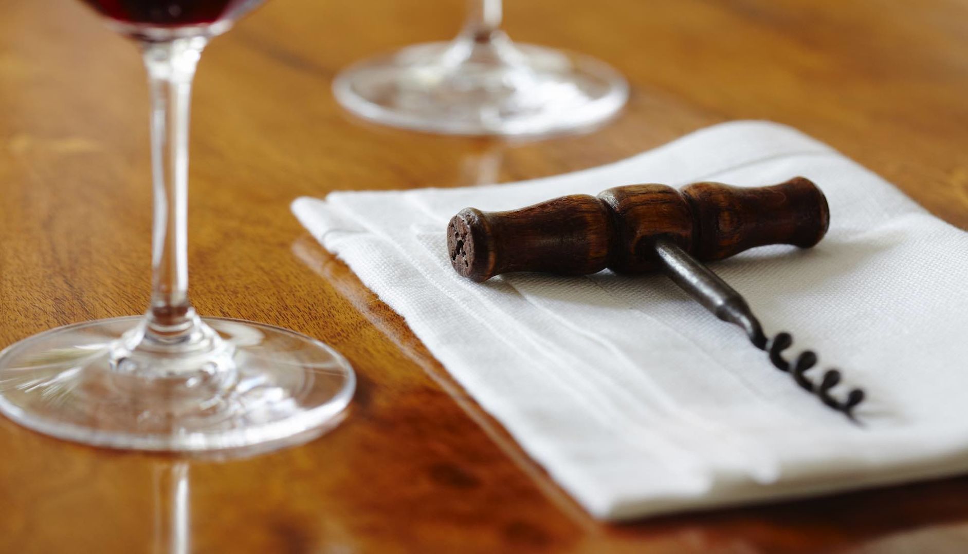 A twist and pull corkscrew on a napkin