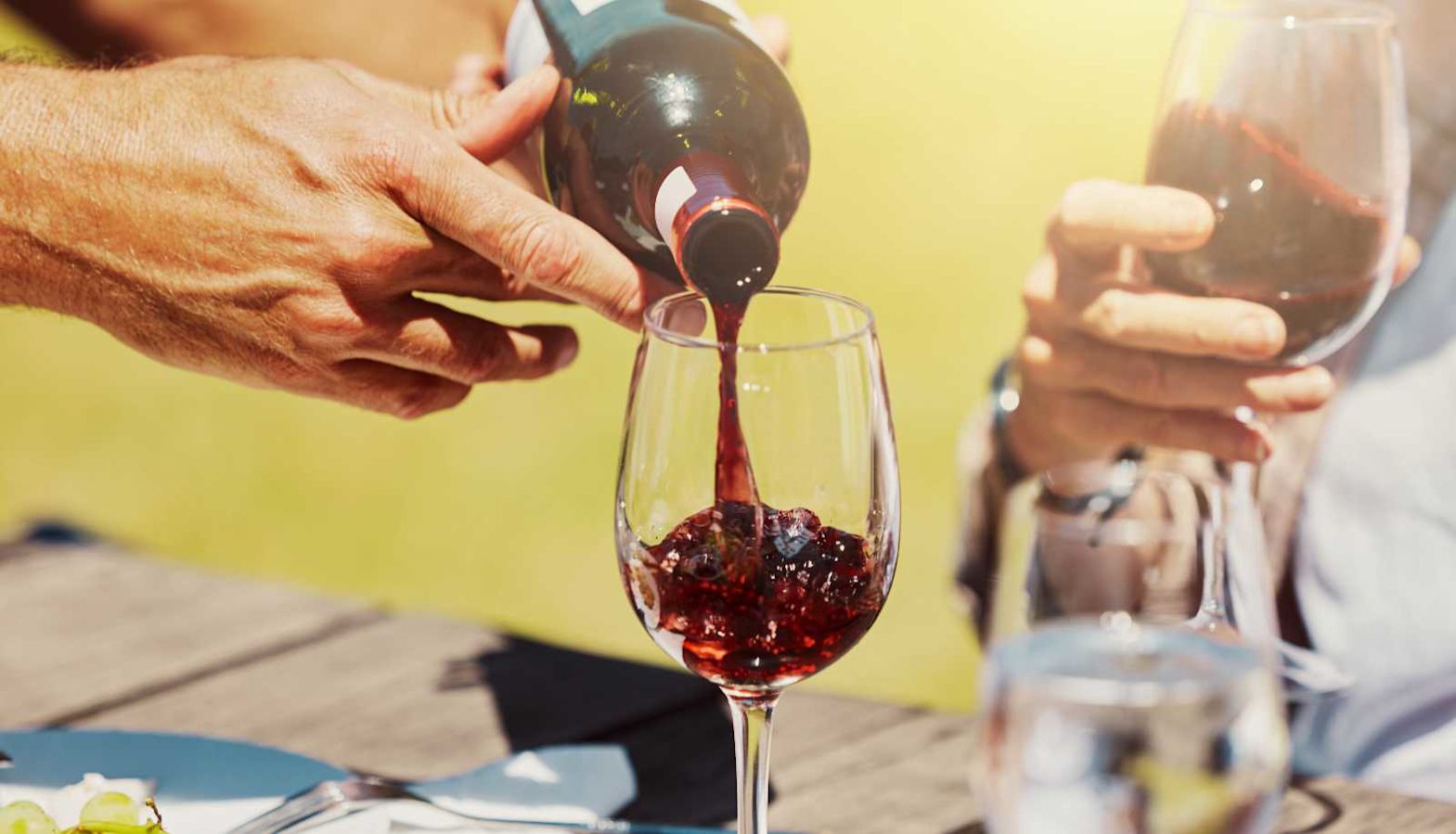 Red wine being poured into a glass - light red wine