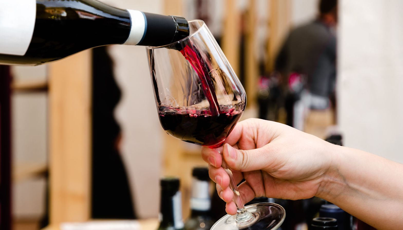 Someone pouring red wine into a glass - Barolo