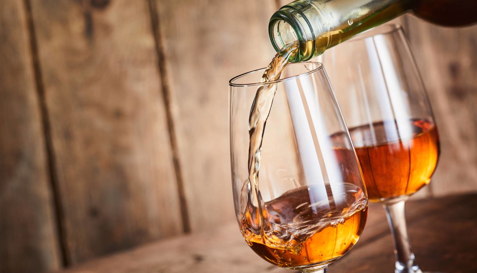 Two glasses of Sherry wine being poured - Sherry wine