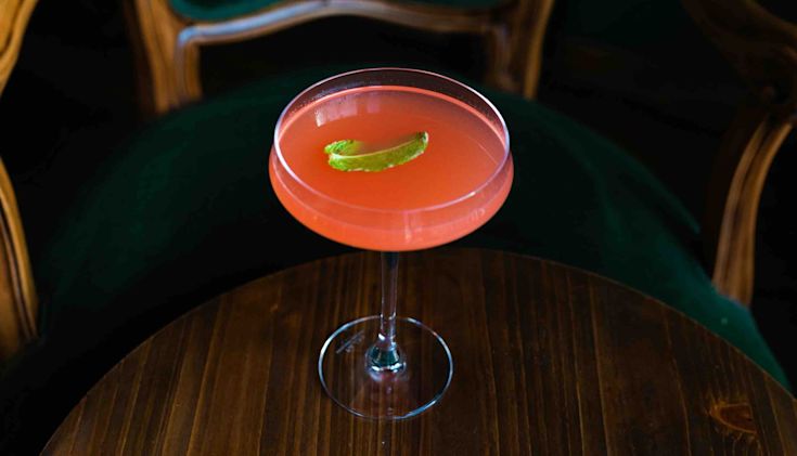 A Cosmopolitan cocktail on a table