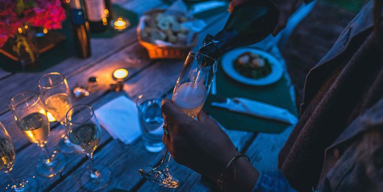 Wine glasses and table night scene