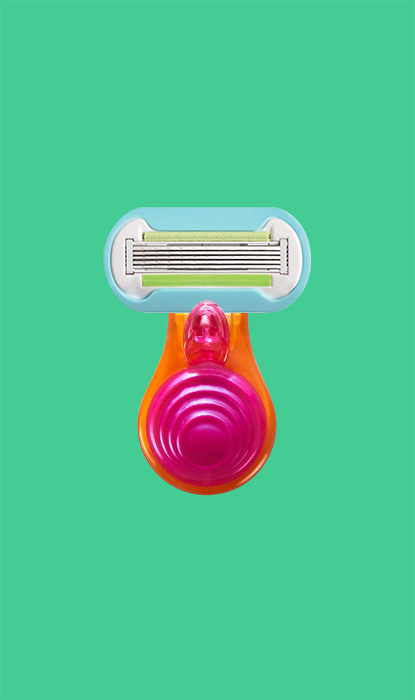 Gillette Venus Extra Smooth Mini-Rasierer auf grünem Hintergrund