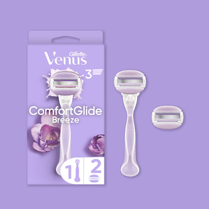 Gillette Venus Comfortglide Breeze razor packaging featuring a floral design and wet look, emphasizing smooth shaving experience.