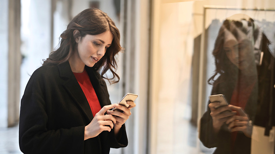 Hero Image, woman looking at cell phone