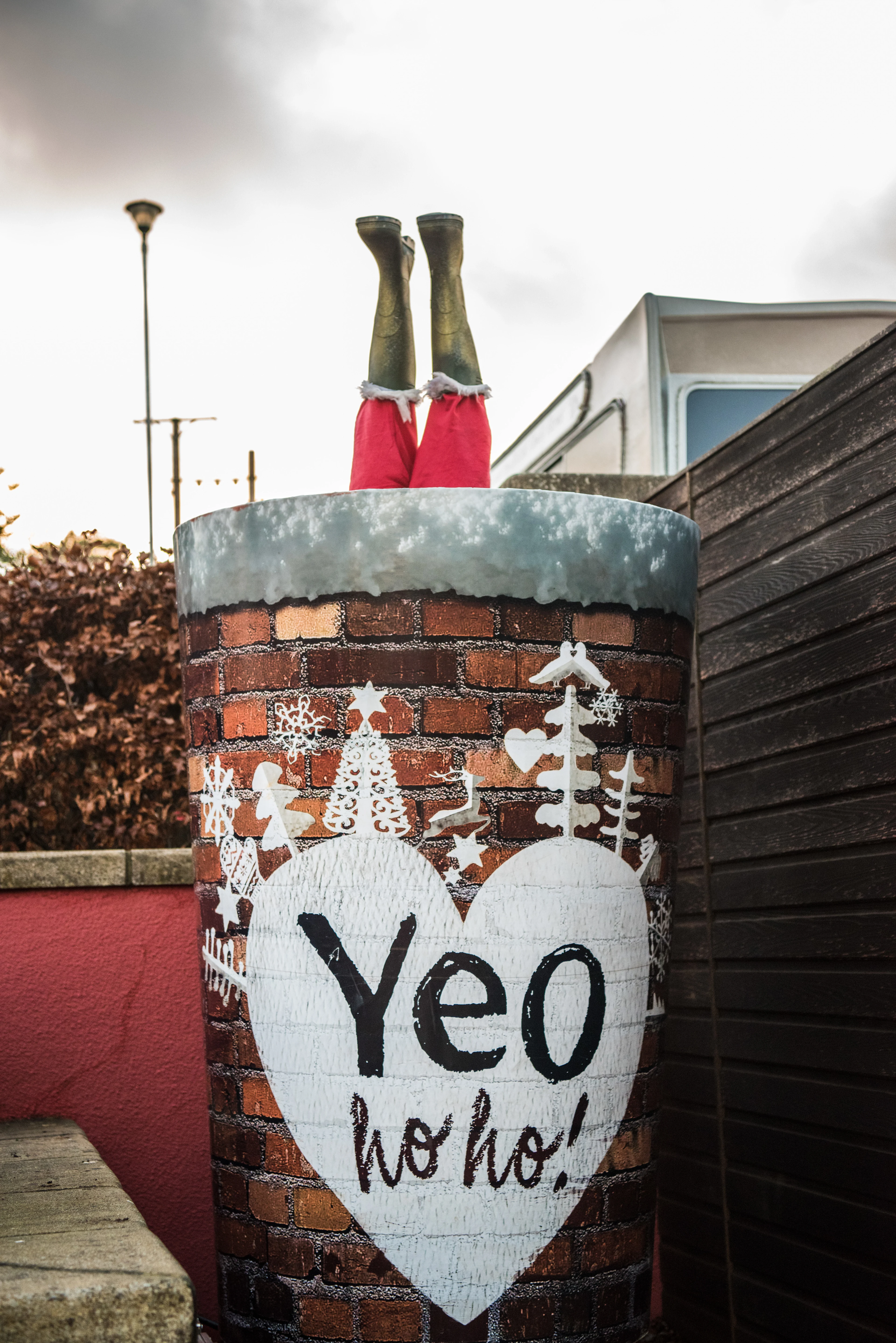 Santas Legs sticking out of a chimney