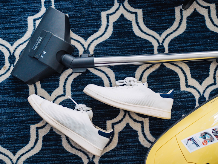 A vacuum cleaner on a carpet