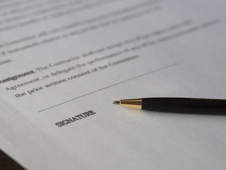 A contract with a pen