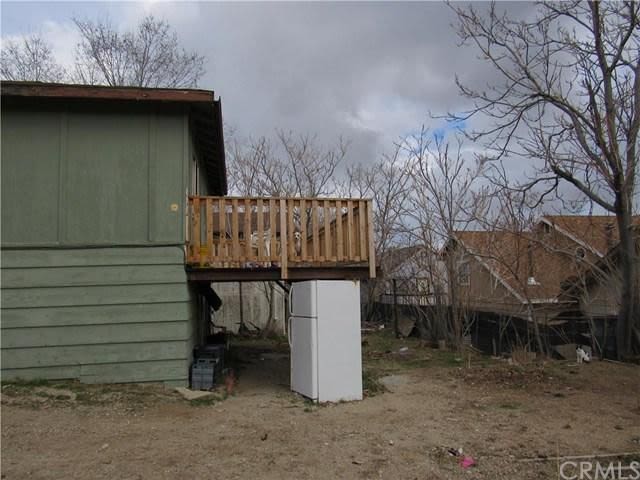 A fridge being used to prop up a balcony/deck
