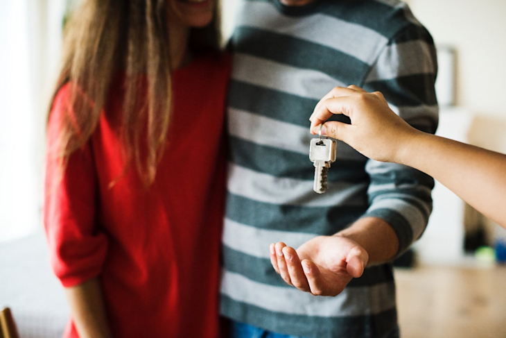 A couple receiving a home key