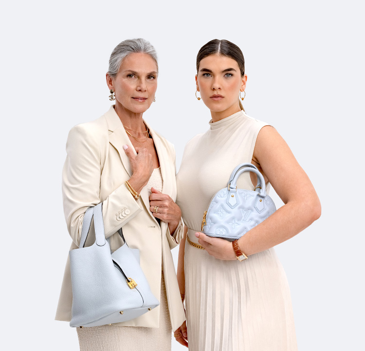 one woman wearing a beige dress and blazer holding a light blue Hermes Picotin bucket bag and another woman wearing a beige sleeveless dress holding a light blue Louis Vuitton monogram embossed mini Alma bag