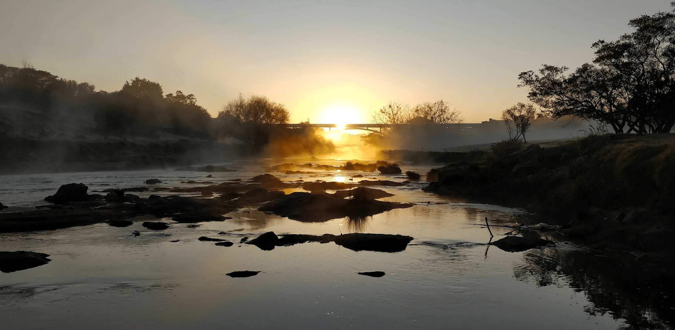 Afrika - Landschap met ondergaande zon en een rivier
