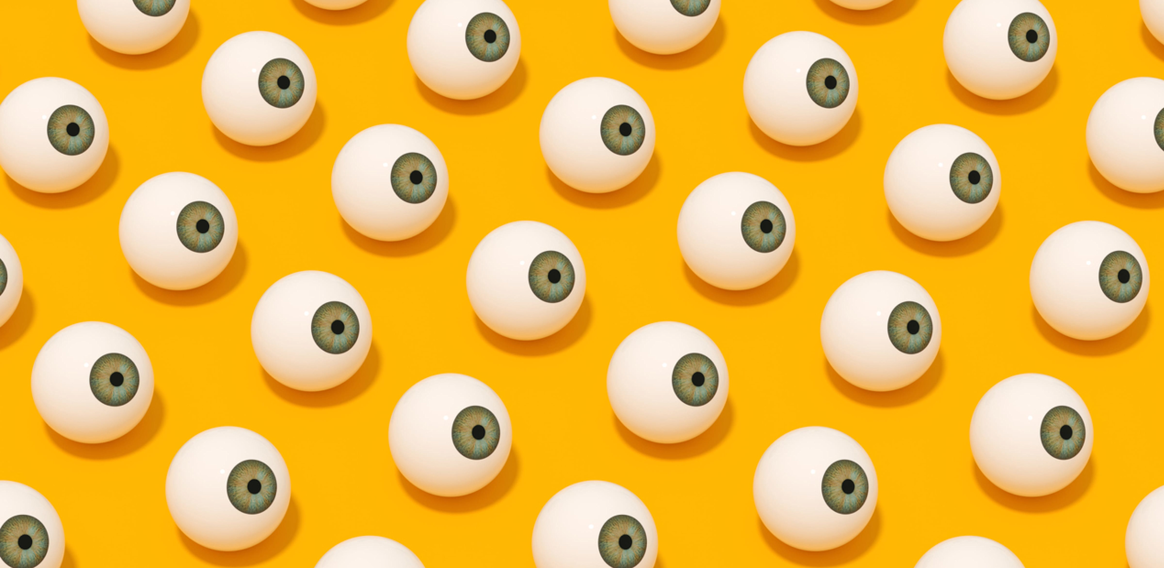 Een gele achtergrond met getekende oogballen
